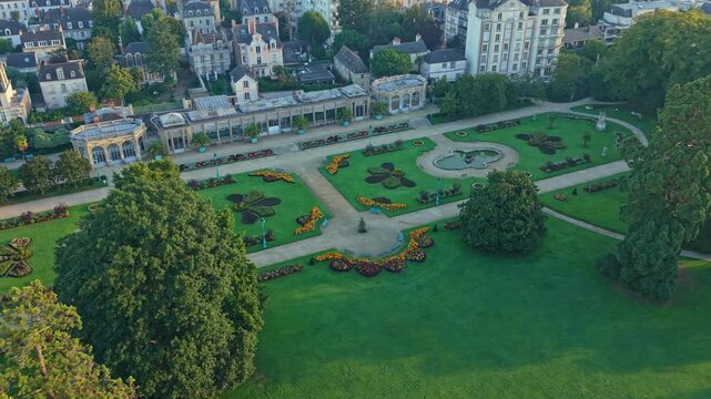 Drone establishing Parc du Thabor revealing formal gardens, lawns, and pathways within Rennes