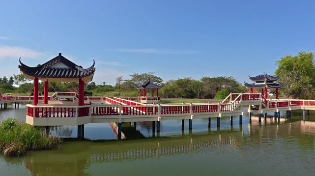 Traditional Chinese pavilion bridge at Tasik Melati Lake in Perlis Malaysia