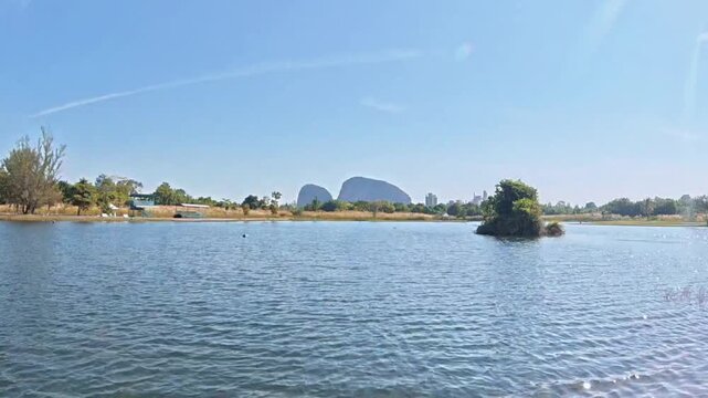 Calm lake landscape at Tasik Melati Perlis Malaysia with clear blue sky