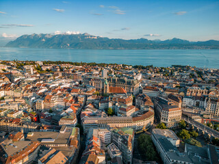 Aerial view of Lausanne city with historic buildings, urban skyline, and Lake Geneva in the background. Lausanne is a major cultural and economic center in western Switzerland © Vgallery