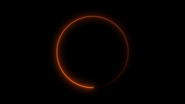 Abstract orange neon glow ring light trail spinning on black background in motion footage