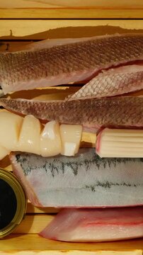 Various Types Of Raw Seafood And Scallops For Sashimi At Japanese Restaurant. - high angle shot