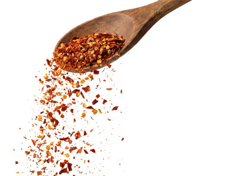 Chili Flakes Pouring From Wooden Spoon. Transparent Background, PNG Style