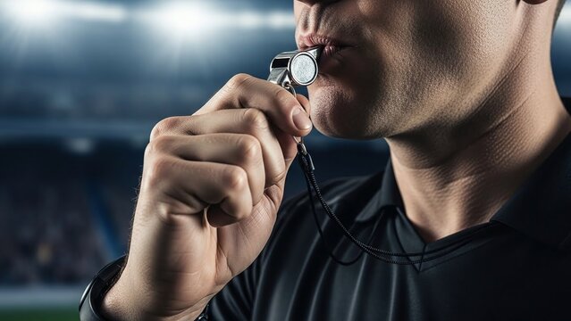 Football referee blowing whistle to control match action during Brazil World Cup game