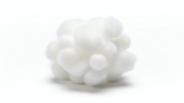 A close-up, slightly blurred view of a white, fluffy, cloud-like object against a clean white backdrop