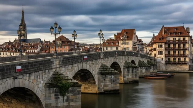 Historic Stone Bridge Over River in European City.