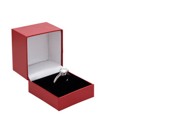 Diamond engagement ring in red gift box for wedding proposal on isolated background