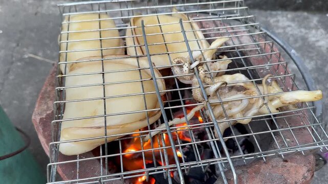 Grilled Squid on Charcoal Stove Thai Street Food Seafood BBQ Close Up Video