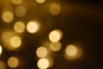 Abstract nature background with dreamy bokeh and soft colorful flower silhouettes in orange and teal.