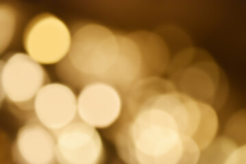 Fototapeta premium Abstract nature background with dreamy bokeh and soft colorful flower silhouettes in orange and teal.