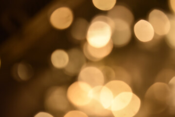 Obraz premium Abstract nature background with dreamy bokeh and soft colorful flower silhouettes in orange and teal.
