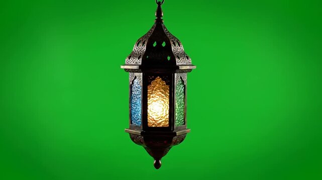 Ornate traditional Islamic lantern with vibrant stained glass panels, elegantly suspended against a bright green screen background, ideal for cultural, festive, and holiday compositing