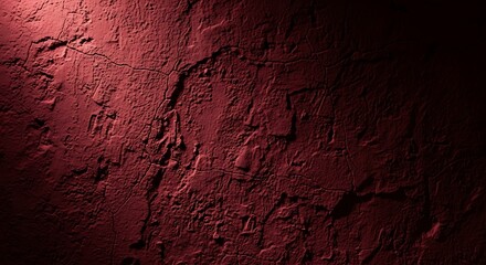 Textured Red Wall with Dramatic Lighting and Shadow Play.