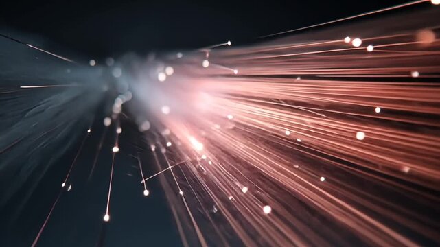 Glowing orange light streaks radiate outward in a dark background with sparkling particles.