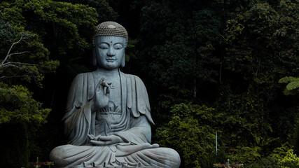 Chin swee caves temple buddha statue ,creating a contrast between spirituality and development