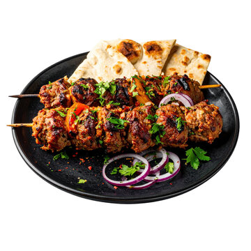 Succulent beef chenjeh kebabs with chelo rice presented on a dark surface, showcasing a classic and satisfying persian cuisine feast