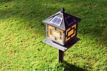 Japanese lamp style on grass in the garden