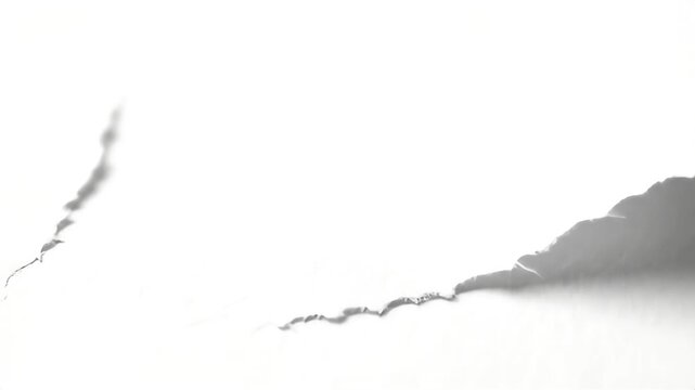 Aerial view of a rugged mountain landscape with a torn shadow effect on a digital illustration