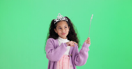 Obraz premium Happy girl, thinking or wand with green screen, costume or halloween party on a studio background. Thoughtful child, kid or princess with fairy tale outfit for magic wish or cosplay on mockup space