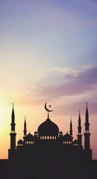 Grand mosque silhouette with crescent moon and star atop dome at vibrant sunset, minarets against pink-orange-blue sky gradient, serene Islamic twilight scene