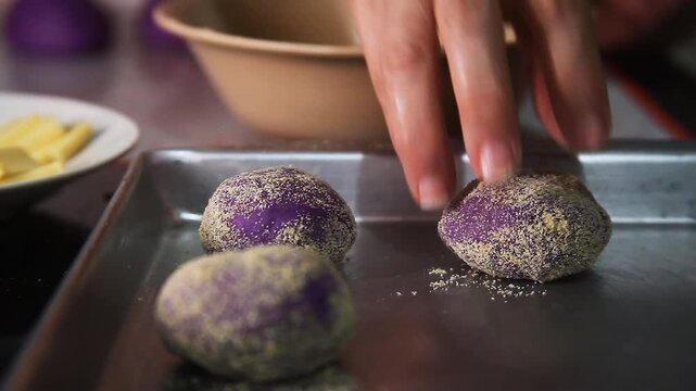 Filipino food called Ube cheese pandesal or bread with yam jam and cheese filling being prepared to be baked.