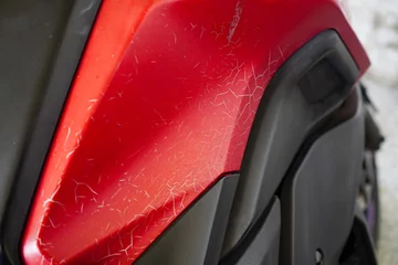 Fototapeten Roller Sun Damaged Cracked Paint Texture On Red Vehicle Body  © ArikEkaSatya