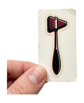 Hand holding reflex hammer paper cutout.