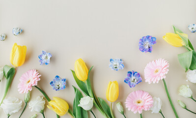 Beautiful spring banner with delicate fresh flowers top view. Greeting card for International Women Day or Mother day. Flat lay.