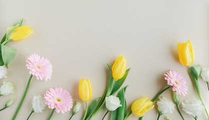 Beautiful spring background with delicate fresh flowers. Greeting card for International Women Day or Mother day. Flat lay.