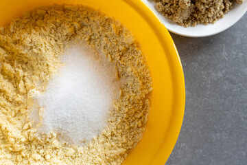 Preparing vanilla crescent cookies &ndash; adding sugar to flour and butter mixture