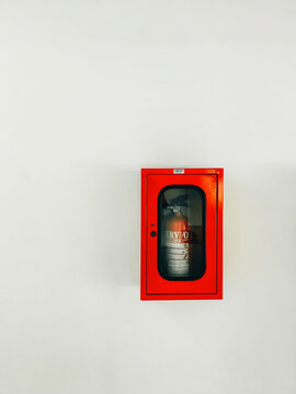 Emergency fire extinguisher on the wall of a building, August 16, 2022, Tangerang, Banten, Indonesia