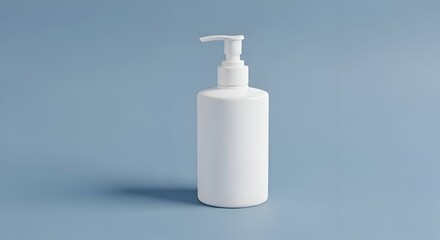 White Liquid Dispenser Bottle on a Blue Background Studio Shot with Copy Space