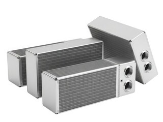 Obraz premium Three metallic heat sinks with fins and mounting holes on a white background