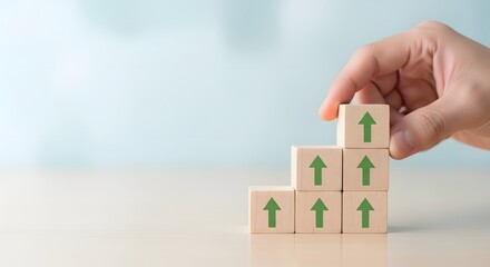 Hand Stacks Wooden Blocks with Upward Arrows