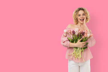 Fototapeta premium A girl smiles while holding a bouquet of flowers