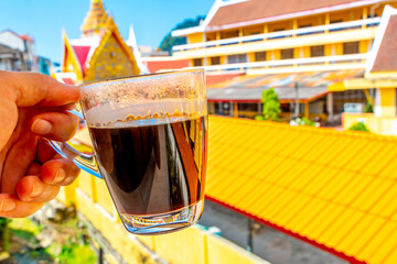 Fototapeta premium Black coffee tropical landscape terrace balcony temple panorama view Thailand.