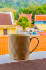 Fototapeta premium Black coffee tropical landscape terrace balcony temple panorama view Thailand.