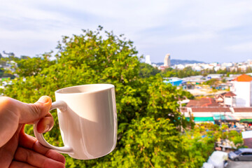 Fototapeta premium Black coffee with tropical landscape terrace balcony panorama view Thailand.