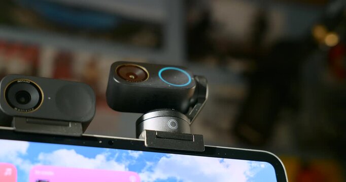 Insta360 Link 2 Pro And 2C Pro Ai Webcam Comparison On Laptop Screen For Video Conferencing And Streaming Featuring Advanced Camera Technology And Design.