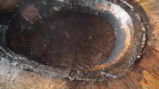 Sugar cane cooking in caldera at El Paradero, Sucre, Venezuela