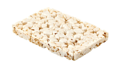 A rectangular, puffed grain cake, light brown, textured, isolated on a black background