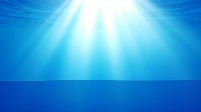 Sunlight rays penetrating deep blue ocean water surface and seabed