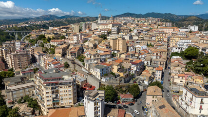 Fototapeta premium Aerial view of the historic center of Catanzaro, located in southern Italy. It is the regional capital of Calabria and is perched on the hills. It is a sunny summer morning.