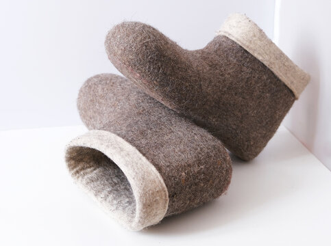 Traditional Russian felt boots on a white background