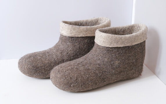 Traditional Russian felt boots on a white background