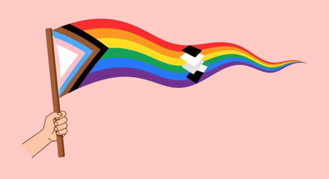 A hand holds a Progress Pride flag with a white chevron and black and brown stripes, waving in the wind against a pink background.