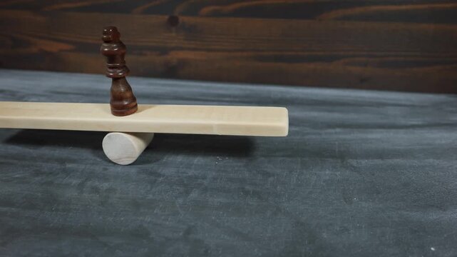Concept Of Societal Equilibrium Illustrated Using A Single Chess King On Balance