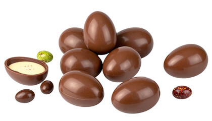 Group of chocolate eggs, some whole, others halved, against black