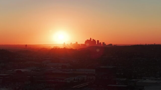 4K Wide Angle Orbit At  Sunset of Downtown Los Angeles in silhouette and orange Apple ProRes 422