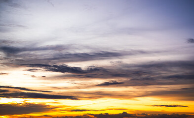 Fototapeta premium Sky sunset evening sunrise cloud weather dramatic landscape goldent and indigo color gradient pastel horizon, twilight yellow golden reflection morning nature environment energy ecosystem change